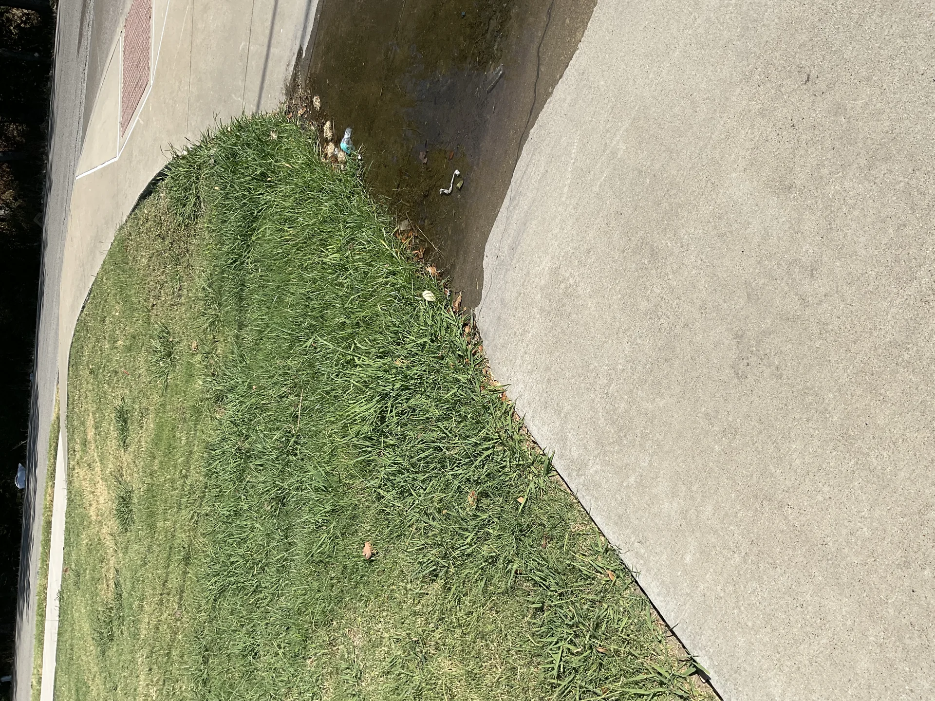 Cross section view of crushed granite base installation for synthetic turf over North Texas clay soil
